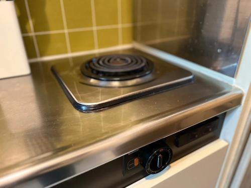 a stove top oven with a burner on it at ラレジダンスドパンテール in Fukuoka