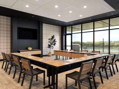 a large conference room with a large table and chairs at Origin Kansas City Riverfront, a Wyndham Hotel in Kansas City