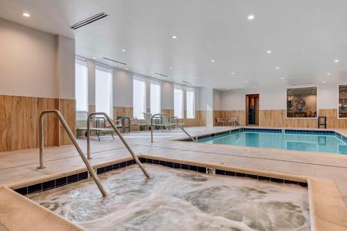 a large indoor pool with a hot tub at Cambria Hotel El Centro - Imperial in El Centro