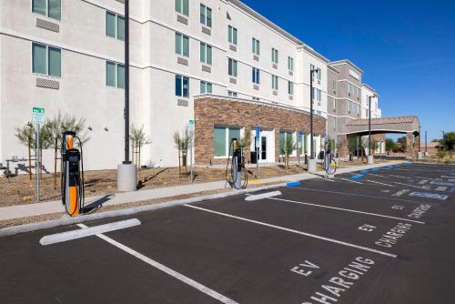 an empty parking lot in front of a building at Cambria Hotel El Centro - Imperial in El Centro
