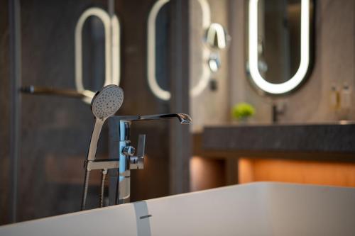 a bathroom sink with a hair dryer on top of it at Holiday Inn Guiyang Airport by IHG in Guiyang