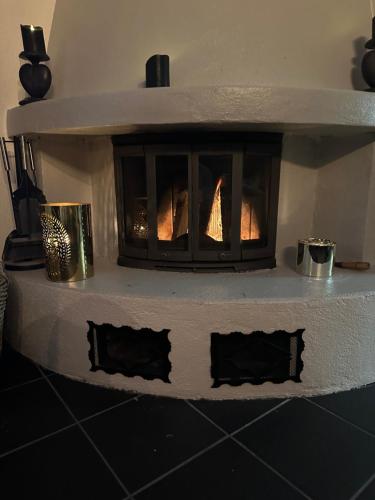 a brick oven with a fire inside of it at Hemsedal-Toppen av Skarsnuten in Hemsedal