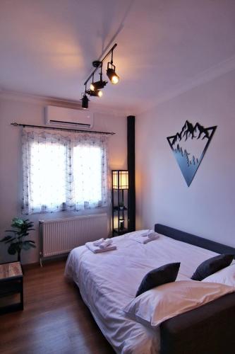 Katil atau katil-katil dalam bilik di Spitaki Kastoria Apartment