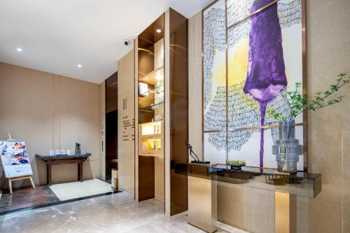 a dressing room with a large painting on the wall at Lavande Hotel Xi'an Bell Tower Muslim Street North Street Subway in Xi'an
