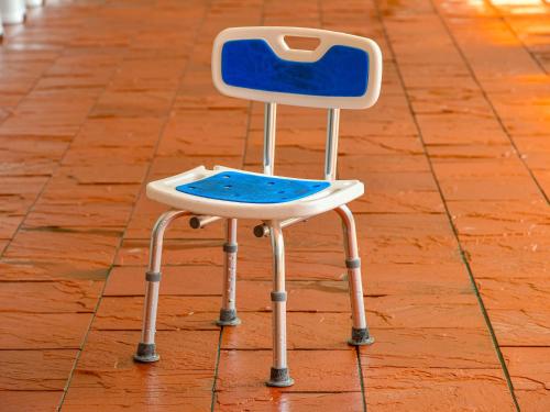 a blue and white chair sitting on the floor at Hokuriku Fukui Awara Onsen Mimatsu in Awara