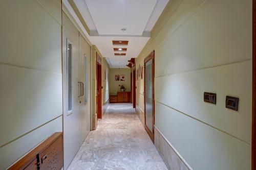 a hallway with white walls and a long hallway at Hotel The Pearl, City Center - Traveler's Choice Award Winner for 2025 in New Delhi
