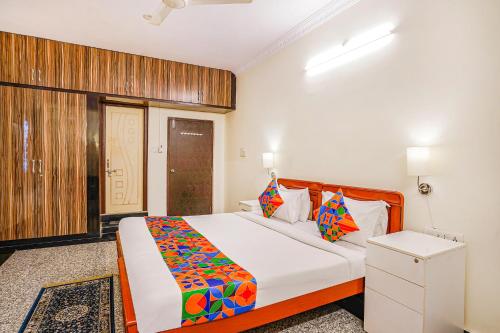 a bedroom with a bed in a room at FabHotel Eminent Suites Banjara Hills - Nr LV Prasad Institute in Hyderabad