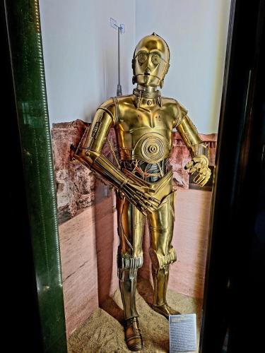 a statue of a man in a gold suit at Hotel Dworski Galaktyczny Park in Szczecin