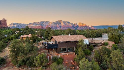 an aerial view of a house with mountains in the background at Roca Roja by AvantStay Mountain Views in the Heart of Sedona in Sedona