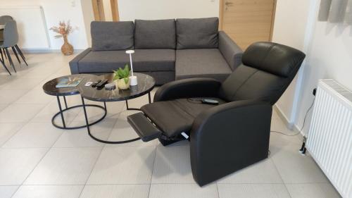 a living room with a couch and a table at MICHELLE PATRASSO - Quiet & comfortable apartment in Patras with free parking in Patra