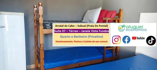 a bed in a room with a sign on it at Arraial do Cabo – Subuai Village - Aluguel Econômico in Arraial do Cabo