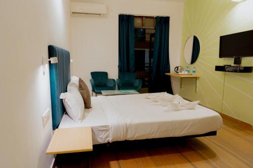 Postel nebo postele na pokoji v ubytování Jolly Panda Resort Goa