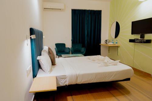 Postel nebo postele na pokoji v ubytování Jolly Panda Resort Goa