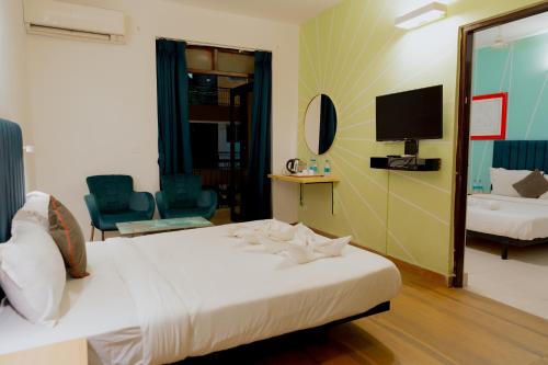 Postel nebo postele na pokoji v ubytování Jolly Panda Resort Goa