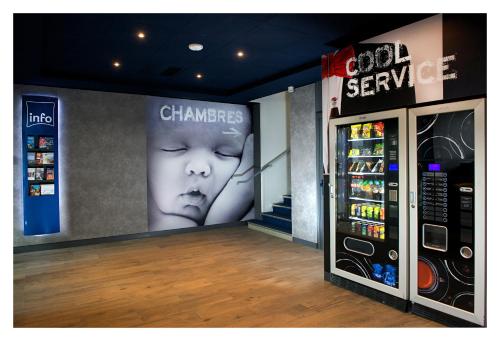 a store with a display of a childs face in a store at Ibis Budget Strasbourg Centre Gare in Strasbourg