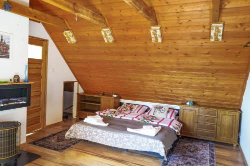 Postel nebo postele na pokoji v ubytování Askaro, Kazimierz Dolny