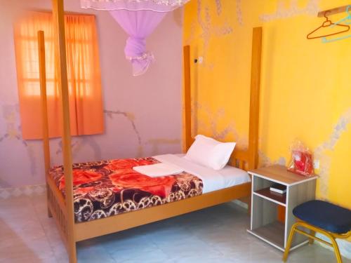 Postel nebo postele na pokoji v ubytování Olukulu Resort and Eco-village