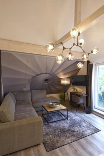 a living room with a couch and a table at Villa Delange in Landau in der Pfalz