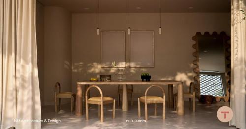 a dining room with a wooden table and chairs at Nghỉ dưỡng tại TERRA VILLA in Vung Tau