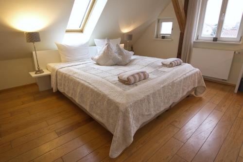 a bedroom with a bed with two pillows on it at Villa Delange in Landau in der Pfalz