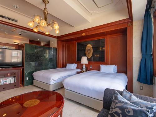 Una cama o camas en una habitación de Hotel Concerto Nagasaki