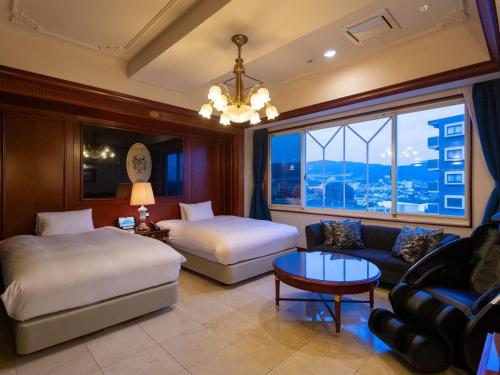 Una cama o camas en una habitación de Hotel Concerto Nagasaki