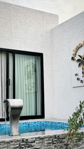Der Swimmingpool an oder in der Nähe von شاليهات بالما