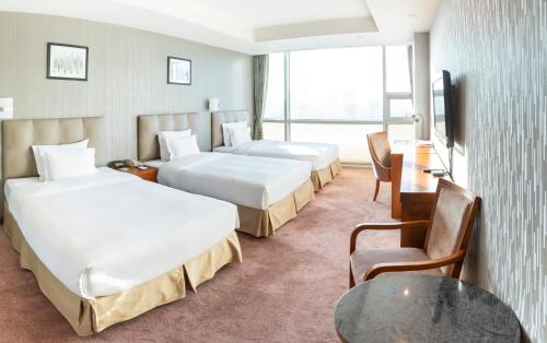 Katil atau katil-katil dalam bilik di The Blue Sky Hotel and Tower