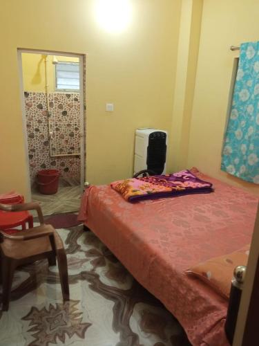 Postel nebo postele na pokoji v ubytování Shiv sakti homestay
