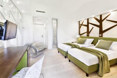 Ai Cadelach Hotel Giuliaにあるベッド