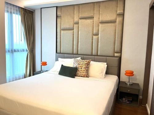 Ένα ή περισσότερα κρεβάτια σε δωμάτιο στο Private sea view apartment at Mida Grande Resort