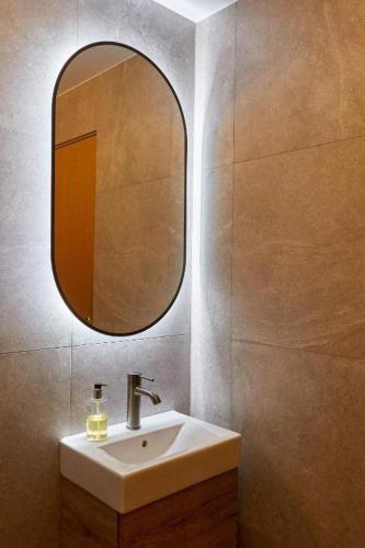 a bathroom with a sink and a mirror at Hótel Laugarvatn in Laugarvatn