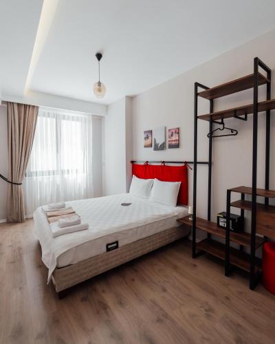 a bedroom with a bed and a bunk bed at Fortunella Suites in Finike