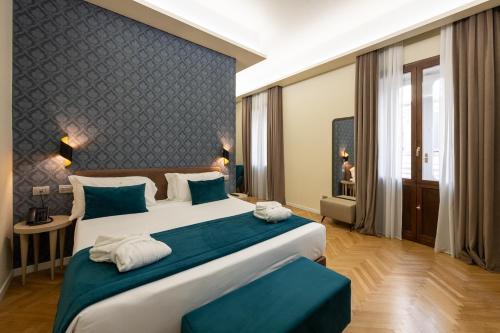 Una cama o camas en una habitación de Hotel Caravita