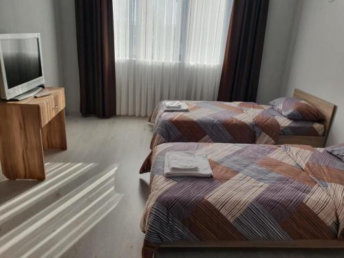 Postel nebo postele na pokoji v ubytování Хотел Радост