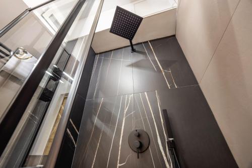 a hallway with a chair on the floor of a building at Al Borghetto marinaro in Palermo
