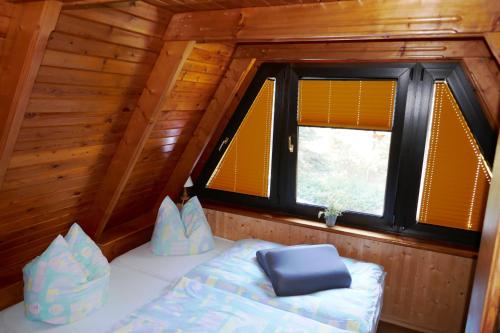 Postel nebo postele na pokoji v ubytování Reetdachhaus in Quilitz auf Usedom