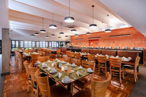 a large dining room with tables and chairs at Hotel 224 & Apartments in Pretoria