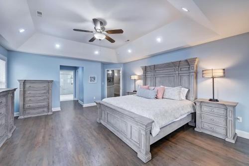 a bedroom with a bed and a ceiling fan at Laid Back Lake Life by AvantStay Waterfront View in Mooresville