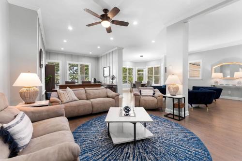 a living room with a couch and a table at Laid Back Lake Life by AvantStay Waterfront View in Mooresville