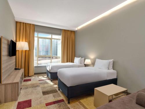 Mercure Makkah Aziziahにあるベッド
