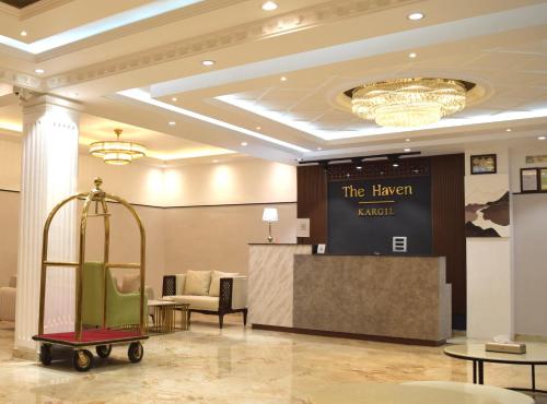 a lobby with a luggage cart in a room at Hotel The Haven - Centrally Heated and Air Conditioned in Kargil