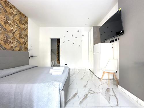 Ένα ή περισσότερα κρεβάτια σε δωμάτιο στο MURIALDO LUXURY