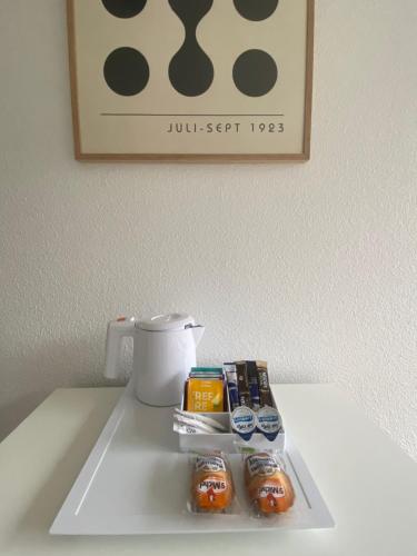 a white tray with food on top of a table at Apparteo Strasbourg in Strasbourg