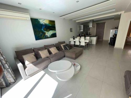 a living room with a couch and a table at Charming 2-bedroom 2 bath apartment - Sliema in Sliema
