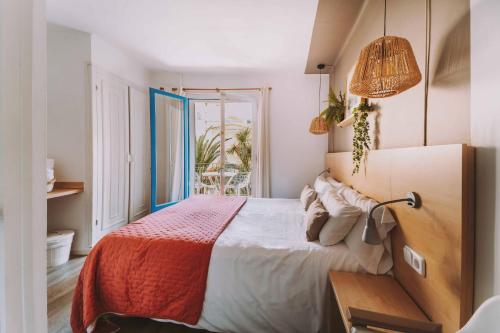 Una cama o camas en una habitación de Hotel Bell Repos