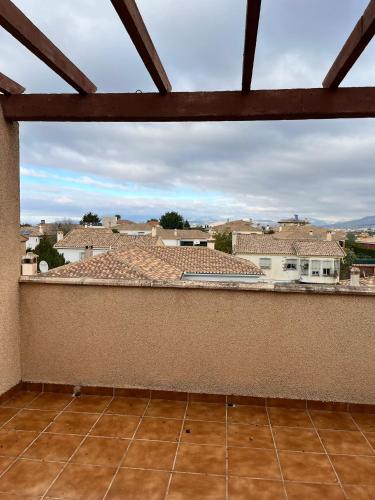 a balcony with a view of a city at El Chalete in Otura