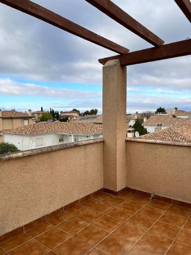 a balcony with a view of the city at El Chalete in Otura