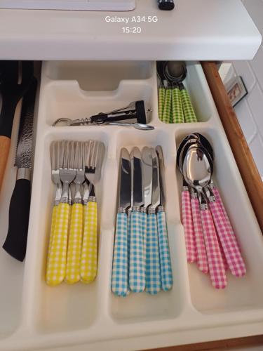 a drawer filled with utensils in a kitchen at Il paradiso sotto le nuvole in Peccioli