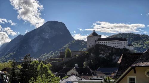a castle on the side of a mountain at Villa Gartenblick in Kufstein